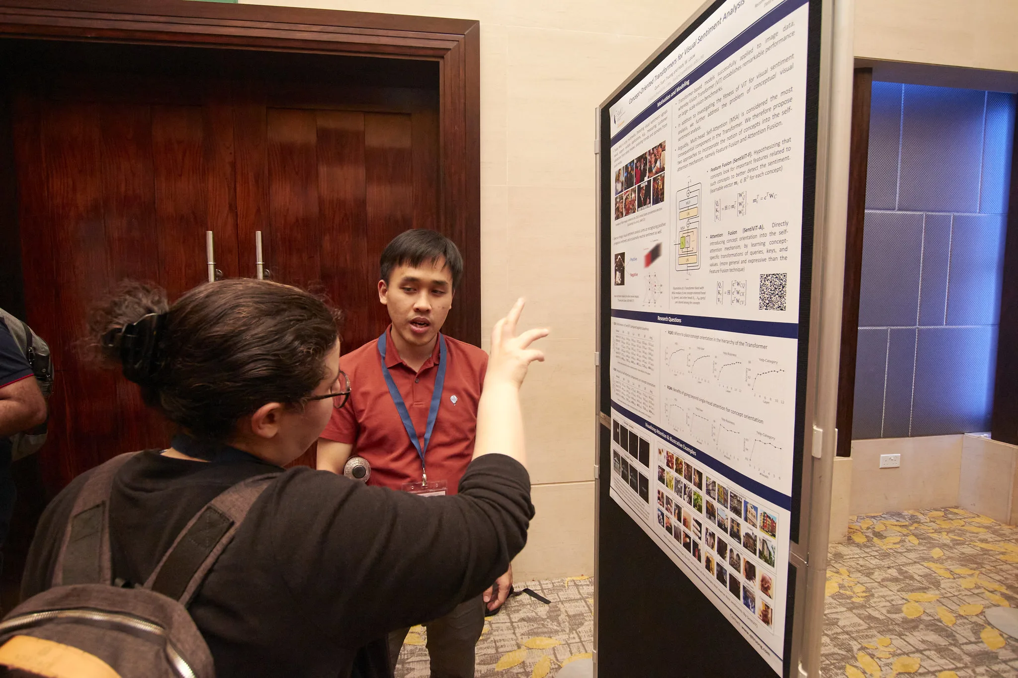 Tuan interacting with attendees on his paper on SentiViT